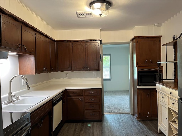 3233 SW 40th St, Oklahoma City, OK 73119 - kitchen featuring visible vents, range, dishwasher, a sink, and dark brown cabinets