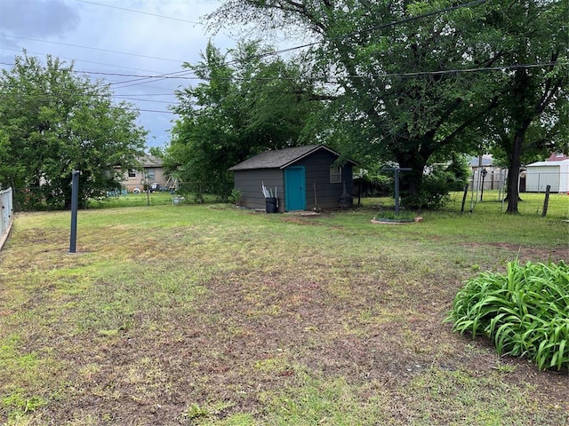 3233 SW 40th St, Oklahoma City, OK 73119 - view of yard with fence, an outbuilding, and a shed