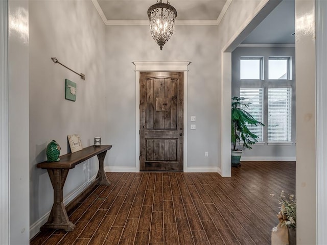 7437 SW 105th St, Oklahoma City, OK 73173 - entrance foyer featuring baseboards, ornamental molding, dark wood finished floors, and an inviting chandelier