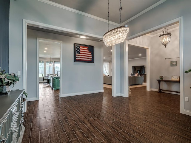 7437 SW 105th St, Oklahoma City, OK 73173 - unfurnished dining area with an inviting chandelier, ornamental molding, baseboards, and dark wood-style floors