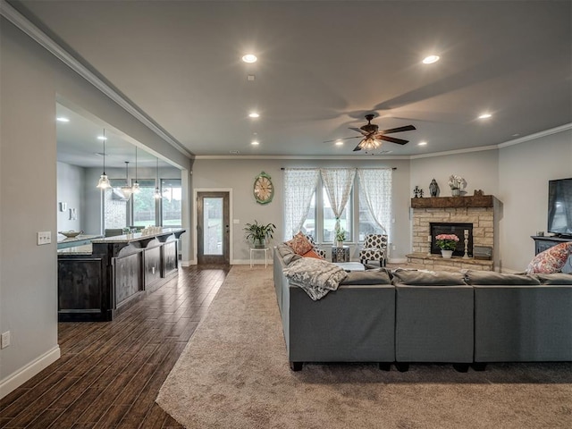 7437 SW 105th St, Oklahoma City, OK 73173 - living area featuring baseboards, ornamental molding, a healthy amount of sunlight, and dark wood-type flooring