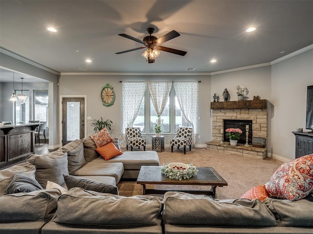7437 SW 105th St, Oklahoma City, OK 73173 - living room with crown molding, a fireplace, recessed lighting, a ceiling fan, and baseboards
