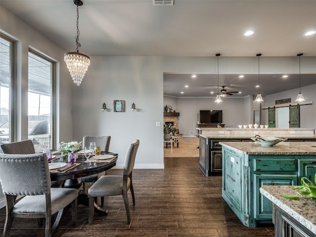 7437 SW 105th St, Oklahoma City, OK 73173 - dining space with visible vents, baseboards, dark wood-style floors, recessed lighting, and ceiling fan with notable chandelier
