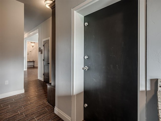 7437 SW 105th St, Oklahoma City, OK 73173 - hallway with baseboards and dark wood-type flooring