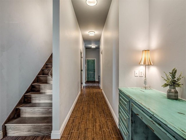 7437 SW 105th St, Oklahoma City, OK 73173 - hallway featuring dark wood-style flooring, baseboards, and stairway