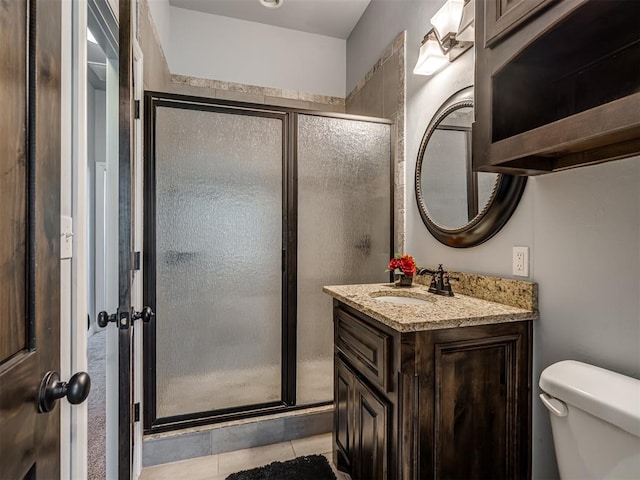 7437 SW 105th St, Oklahoma City, OK 73173 - full bathroom with vanity, tile patterned floors, toilet, and a shower stall