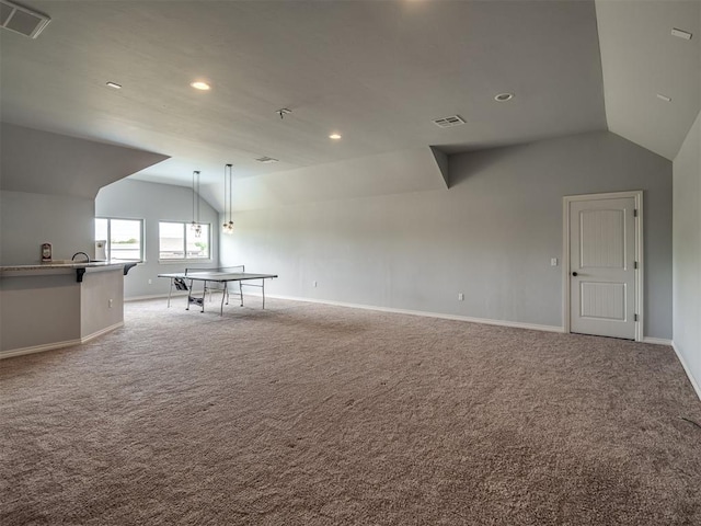 7437 SW 105th St, Oklahoma City, OK 73173 - spare room featuring carpet flooring, vaulted ceiling, and visible vents