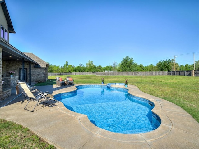 7437 SW 105th St, Oklahoma City, OK 73173 - view of swimming pool featuring a yard, a patio, a pool with connected hot tub, and a fenced backyard