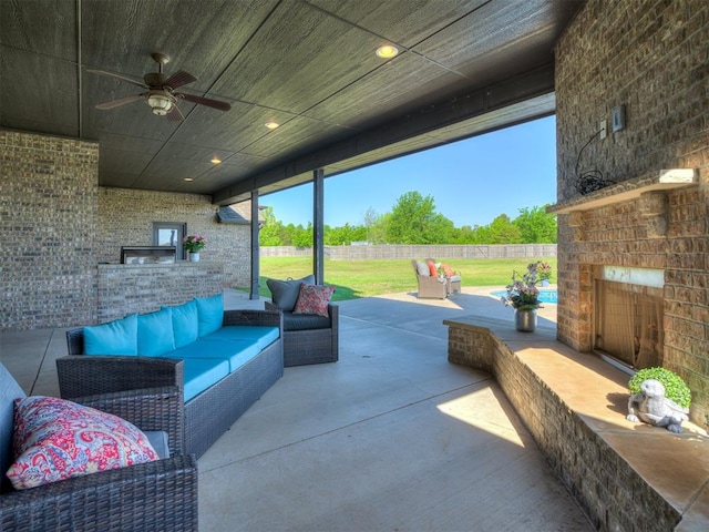 7437 SW 105th St, Oklahoma City, OK 73173 - view of patio / terrace with a fenced backyard, an outdoor living space with a fireplace, and ceiling fan