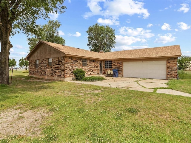 ranch-style house with a garage, a front lawn, and concrete driveway