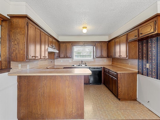 kitchen with dishwasher, under cabinet range hood, a peninsula, a textured ceiling, and light countertops
