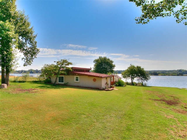 view of yard with a water view