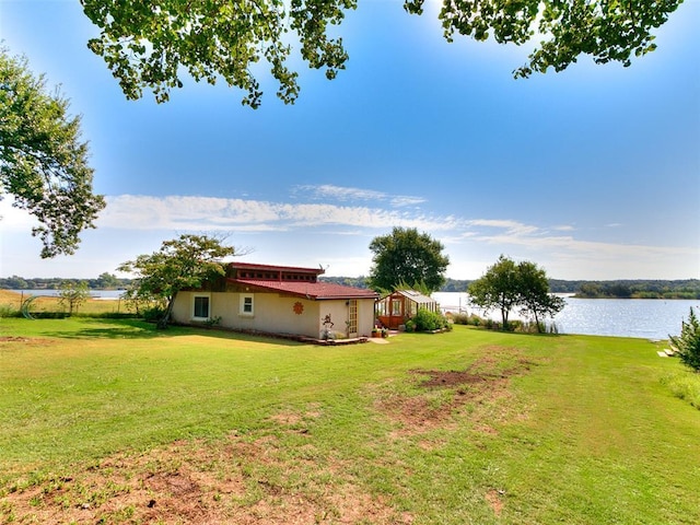 view of yard with a water view