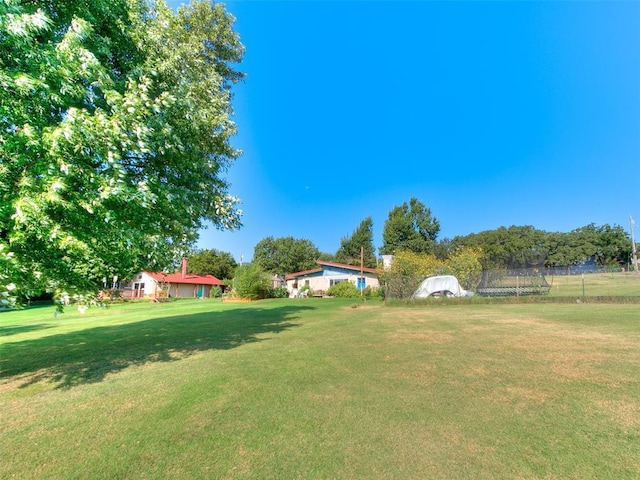 view of yard featuring a trampoline