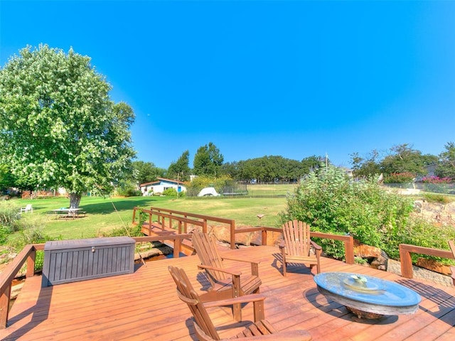 wooden terrace with a yard