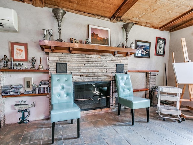 sitting room with tile patterned flooring, an AC wall unit, a glass covered fireplace, beamed ceiling, and visible vents