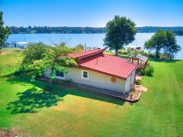 birds eye view of property with a water view
