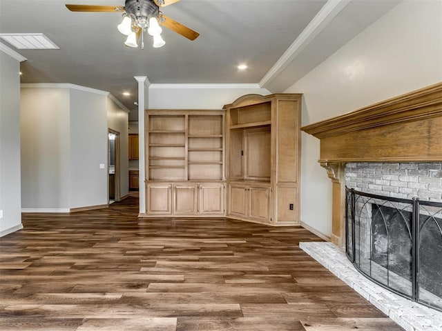 unfurnished living room with baseboards, ornamental molding, a ceiling fan, and dark wood finished floors