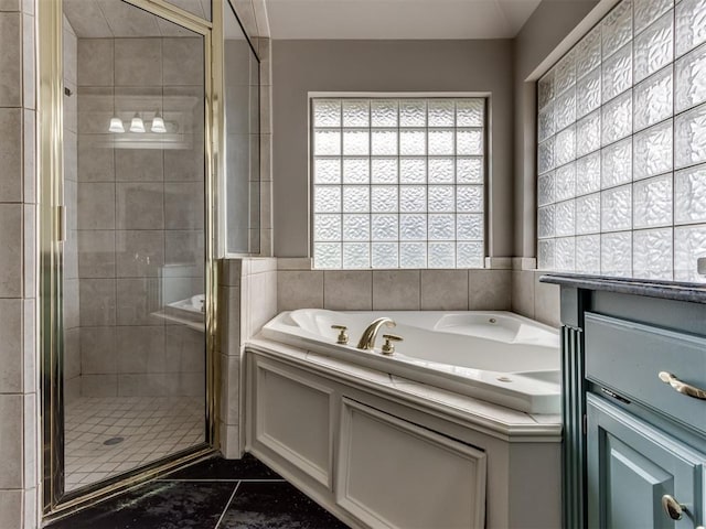 full bathroom with a garden tub, tile patterned floors, and a shower stall