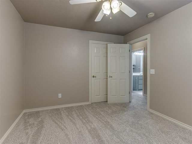 unfurnished bedroom featuring baseboards, ceiling fan, and carpet flooring