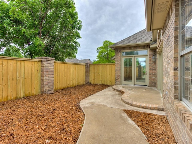 view of yard with a patio and a fenced backyard