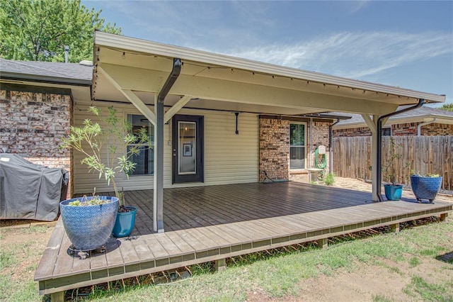 deck featuring fence and area for grilling