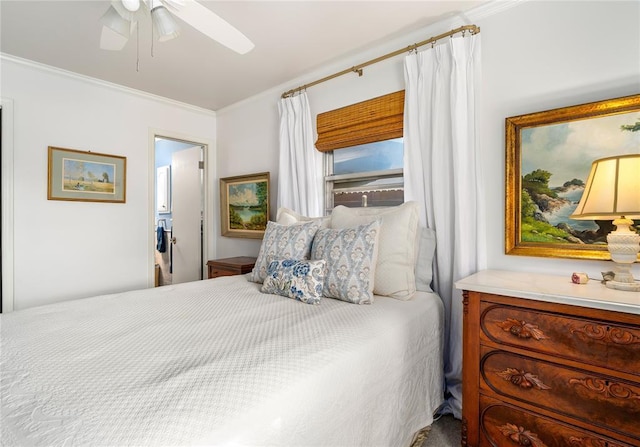 bedroom featuring crown molding and a ceiling fan