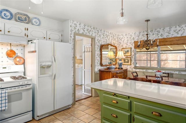kitchen with white appliances, wallpapered walls, white cabinetry, under cabinet range hood, and green cabinets