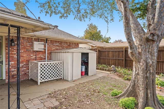 exterior space featuring fence, a storage unit, and an outdoor structure