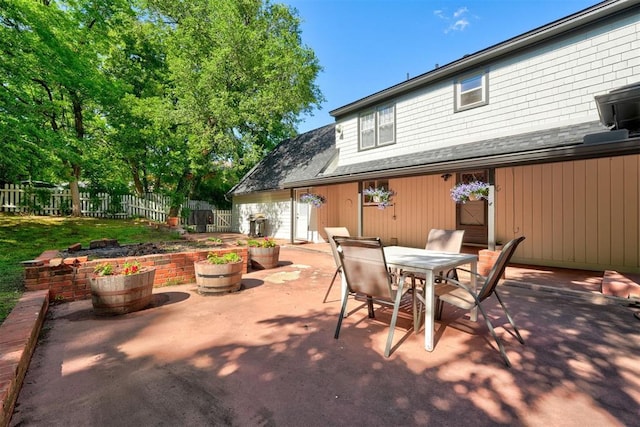 view of patio with fence and outdoor dining space