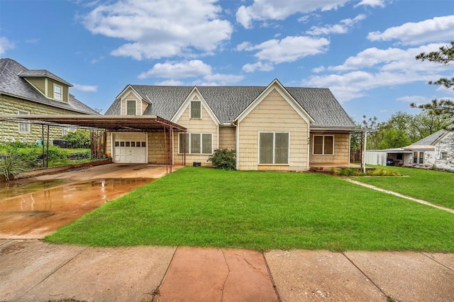 view of front facade featuring a garage, a front lawn, and concrete driveway