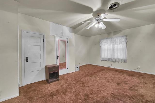 unfurnished bedroom with carpet floors, a ceiling fan, baseboards, and visible vents