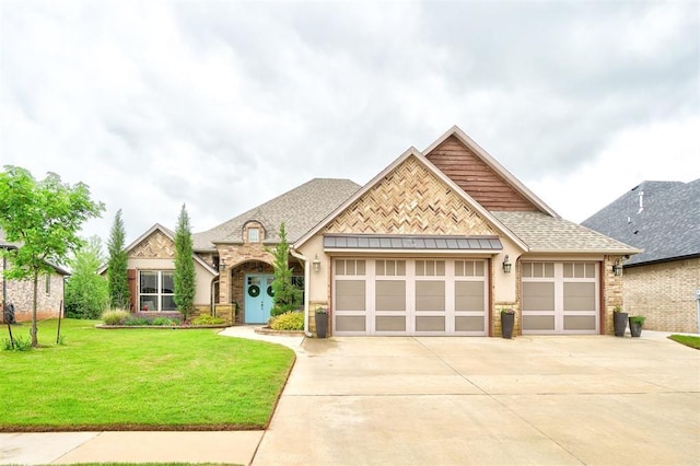 view of front of property featuring an attached garage, a front lawn, stone siding, stucco siding, and driveway