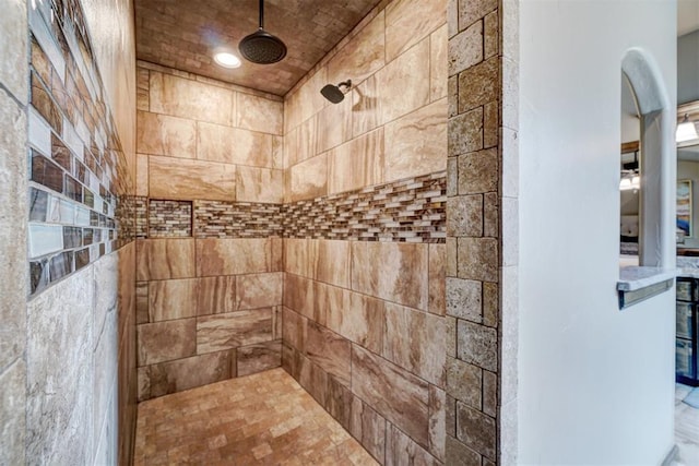 full bath featuring tiled shower