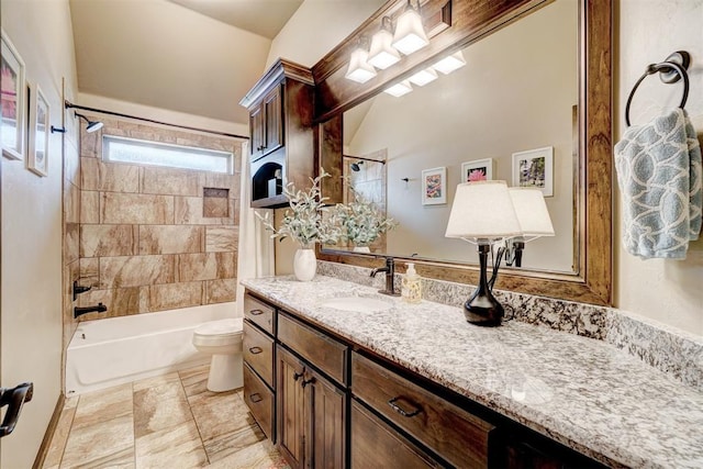 full bath featuring vanity, bathing tub / shower combination, and toilet