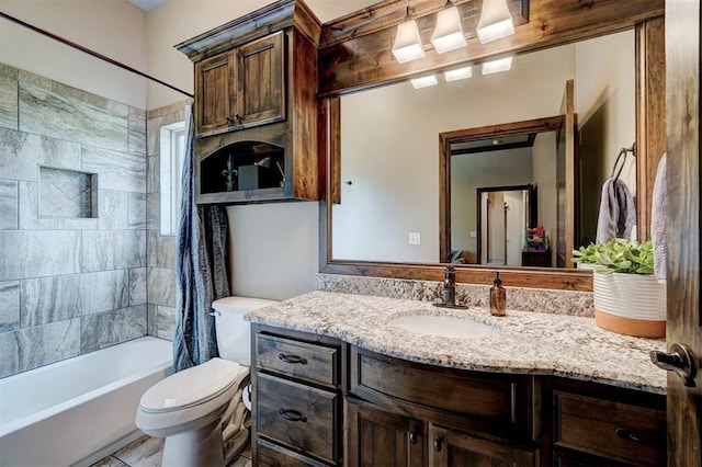 bathroom featuring vanity, shower / bath combo with shower curtain, and toilet