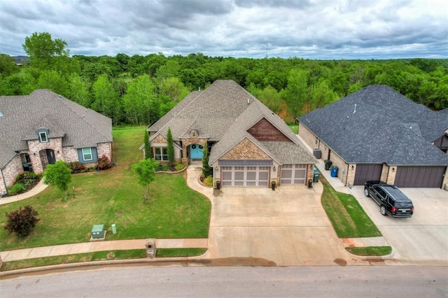 drone / aerial view featuring a view of trees