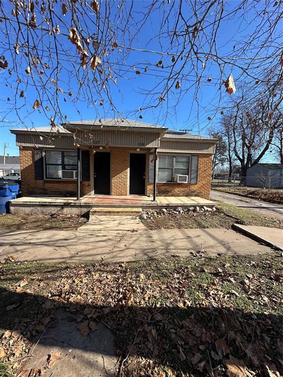 view of front of home with brick siding