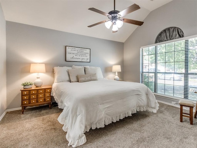 carpeted bedroom featuring baseboards, ceiling fan, and vaulted ceiling