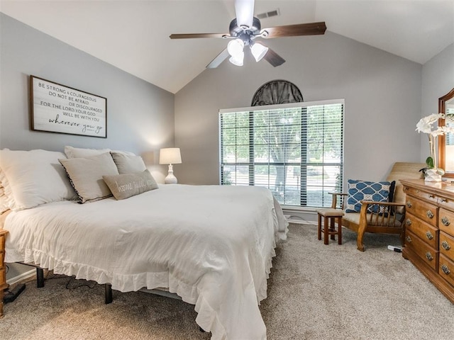 bedroom with carpet floors, ceiling fan, vaulted ceiling, and visible vents