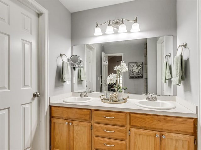 bathroom featuring a sink and double vanity