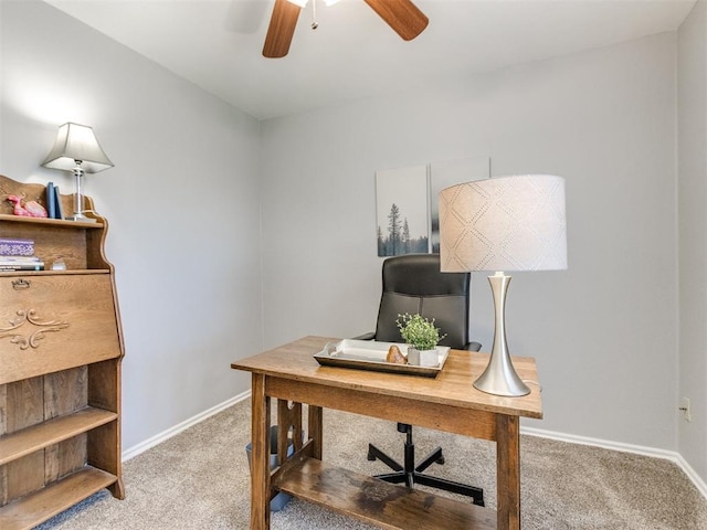office with ceiling fan, light colored carpet, and baseboards
