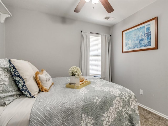 bedroom with visible vents, carpet flooring, baseboards, and ceiling fan