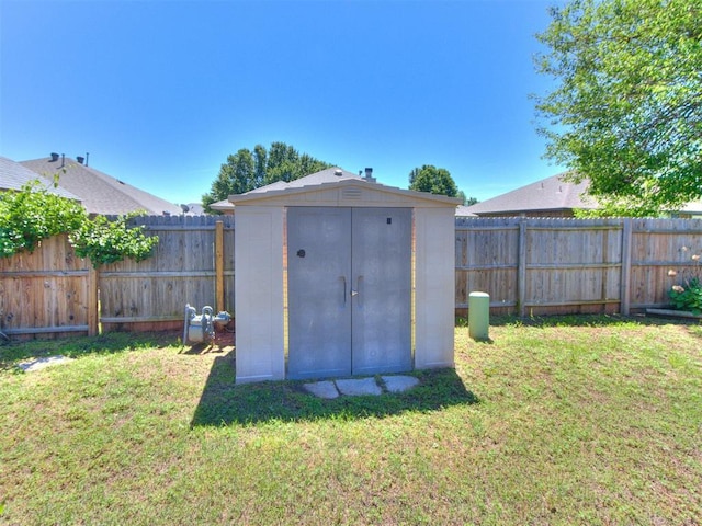 view of shed with a fenced backyard