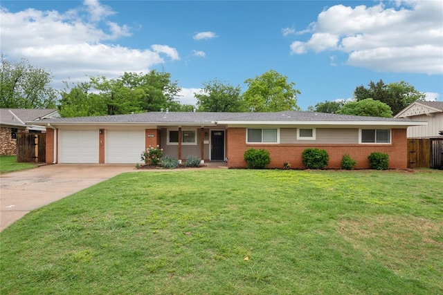 2417 NW 55th Ter, Oklahoma City, OK 73112 - ranch-style home with fence, an attached garage, brick siding, a front yard, and driveway