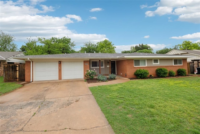 2417 NW 55th Ter, Oklahoma City, OK 73112 - ranch-style house with driveway, a front yard, brick siding, fence, and an attached garage
