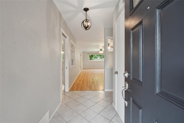 2417 NW 55th Ter, Oklahoma City, OK 73112 - foyer entrance featuring baseboards, ceiling fan, and light tile patterned floors