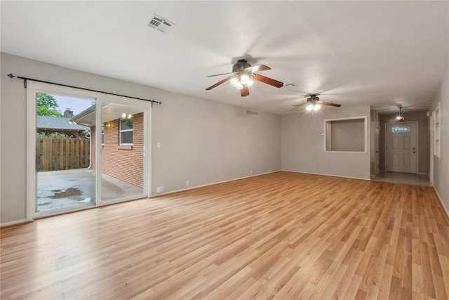 2417 NW 55th Ter, Oklahoma City, OK 73112 - empty room with baseboards, ceiling fan, visible vents, and light wood-style flooring