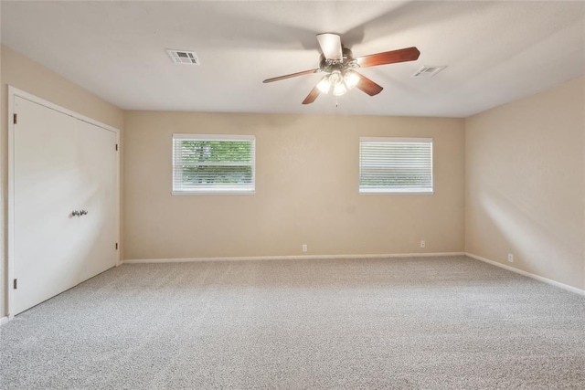 2417 NW 55th Ter, Oklahoma City, OK 73112 - carpeted spare room featuring a ceiling fan, baseboards, and visible vents