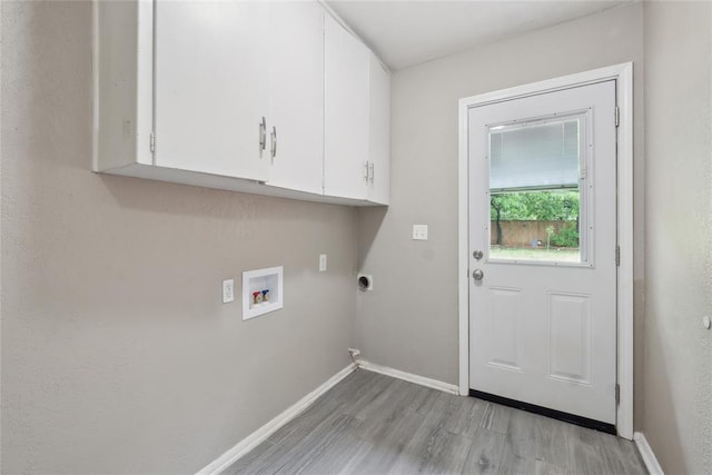 2417 NW 55th Ter, Oklahoma City, OK 73112 - laundry room with cabinet space, washer hookup, baseboards, light wood-type flooring, and hookup for an electric dryer